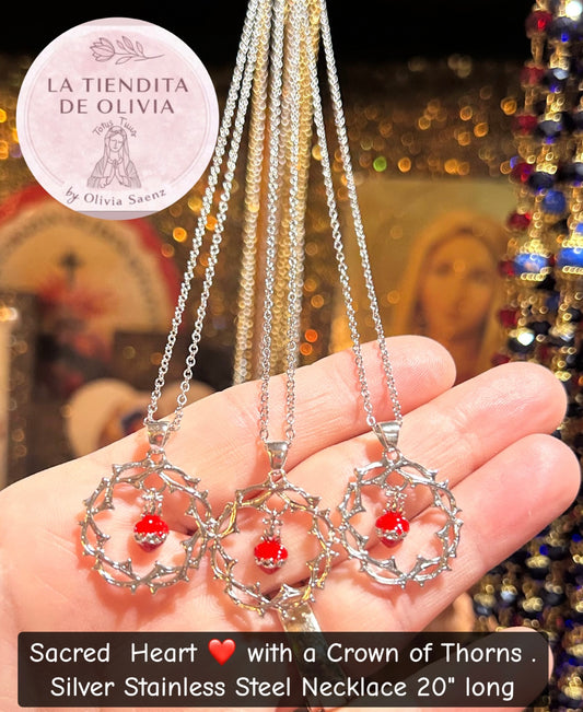 Sacred Heart ❤️ with a Crown of Thorns.
Silver Stainless Steel Necklace 20" long