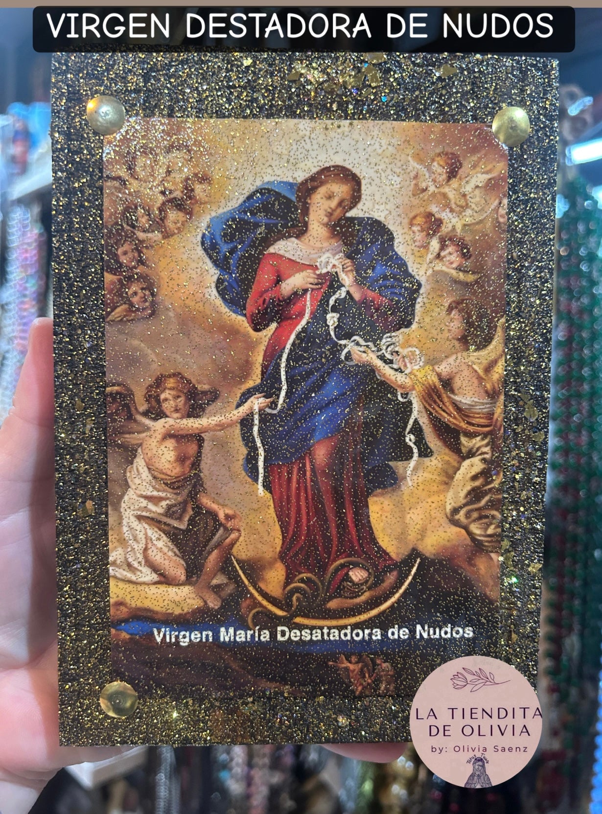Virgen Desatadora de Nudos                         Cuadro de Madera 
Medidas Aproximadas 5” x  7”

Elaborado y Diseñado por LA TIENDITA DE OLIVIA